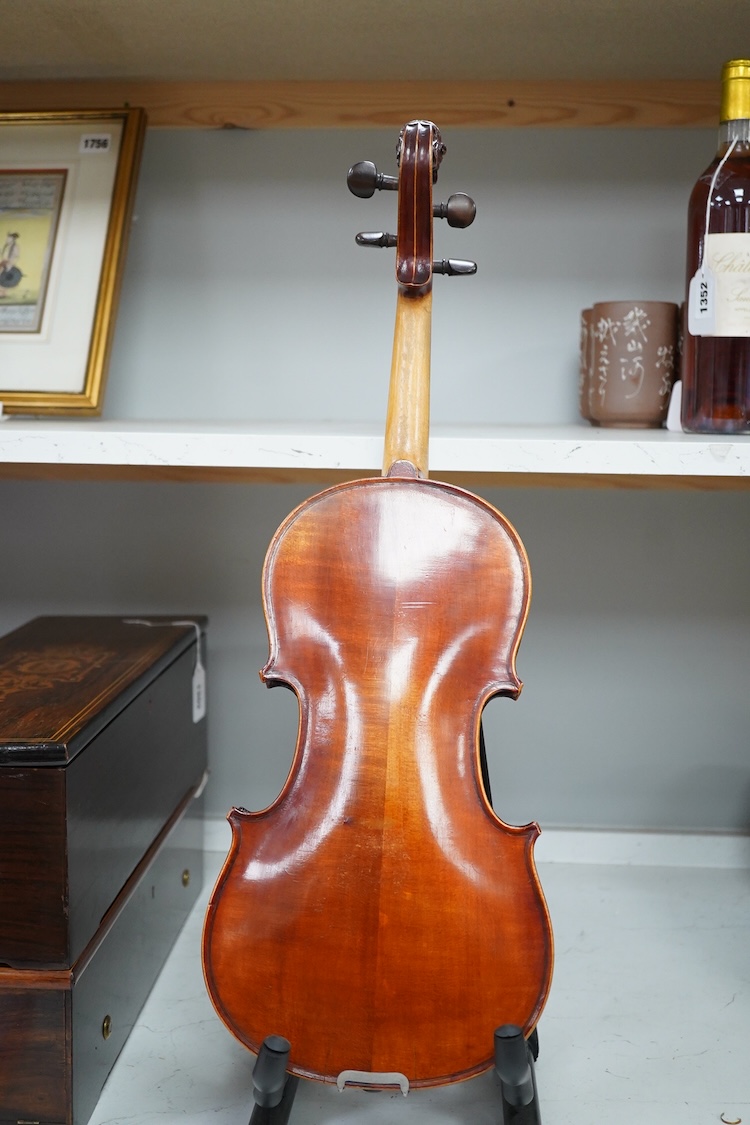 A cased late 19th century German Mittenwald violin with lion’s head scroll, and two bows, Ivory submission ref: RP2E5HT1